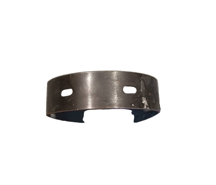 Metallic bearing on a textured gray surface